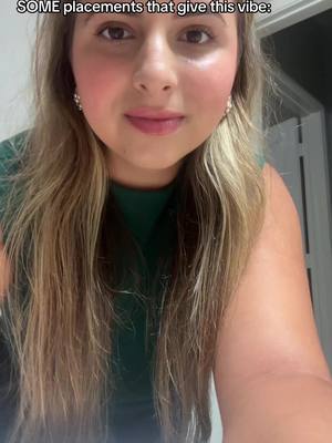 A close-up selfie of a young woman with long, light brown hair. She has fair skin, rosy cheeks, and is wearing earrings. The background is slightly blurred, suggesting a room interior. Text overlayed on top says "SOME placements that give this vibe:".