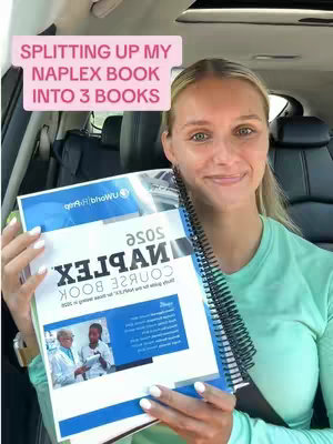 A blonde woman smiles while holding a spiral-bound book, appearing to be in a car. A text overlay reads, "SPLITTING UP MY NAPLEX BOOK INTO 3 BOOKS".