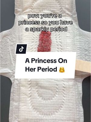 A cover image featuring a white sanitary pad with a depiction of period blood inside. Overlay text uses a princess theme. Beneath the pad sits a white rectangle with text and a TikTok logo.