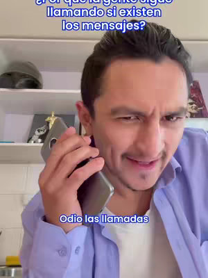 A man is on a video call, with an exasperated expression, holding a smartphone to his ear. Text overlays include a question above his head and a statement at the bottom, while background consists of a shelf.