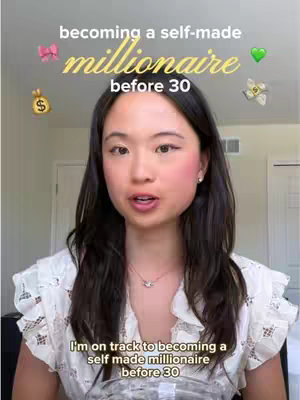 A woman with long dark hair is centered in the frame, her head and shoulders visible. She is facing the camera and speaking; the background is blurred but appears to be an interior space, possibly a home. Overlay text at the top says 'becoming a self-made millionaire', and at the bottom, 'I'm on track to becoming a self made millionaire before 30'.