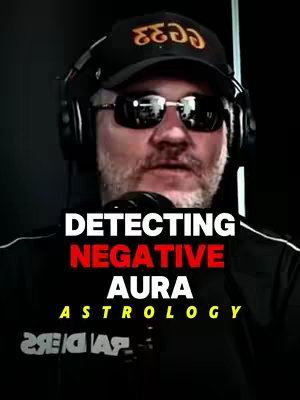 A man wearing sunglasses, a hat, and a headset is centered in a medium shot against a shadowy background. Bold white and red text overlays the image, advertising astrology-related content.