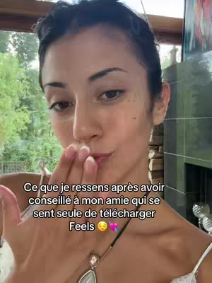 A woman's face, making a kissing gesture with her hand in front of her mouth. Text overlays cover the bottom part of the image.