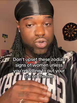 A man with dark skin and braids gazes directly at the camera. He wears a black durag, a nose ring, and a black jersey. Text overlays the image, providing context.