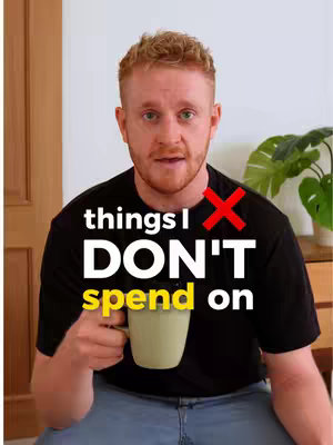 The cover image features a man with reddish hair, wearing a black t-shirt, against a blurred indoor background. Text overlays read 'things I DON'T spend on' over his image. The man is holding a light green mug.