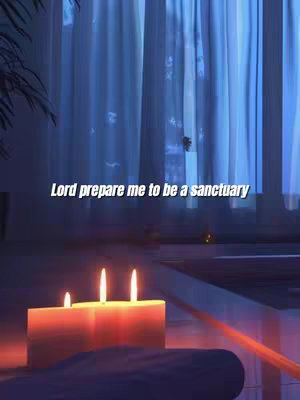 The image features a serene scene with a soft, blurred background of blue curtains. In the foreground, three candles with glowing flames are set atop a reflective surface. The text "Lord prepare me to be a sanctuary" is overlaid in the center.