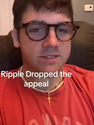 A man with glasses is centered in the frame, wearing a red shirt. The overlay text reads 'Ripple Dropped the appeal'.