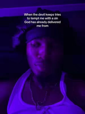 The cover image features a dimly lit environment with purple lighting. A person, likely the creator, is positioned in the center. The text overlay states: "When the devil keeps tries to tempt me with a sin God has already delivered me from."
