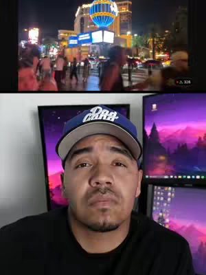 The cover image is split, with the top showing a bustling nighttime street scene in Las Vegas, illuminated with bright lights, prominent buildings, and a large, illuminated globe. Below this, a man wearing a baseball cap stares intently at the camera, with two computer monitors with purple gradient backgrounds behind him.