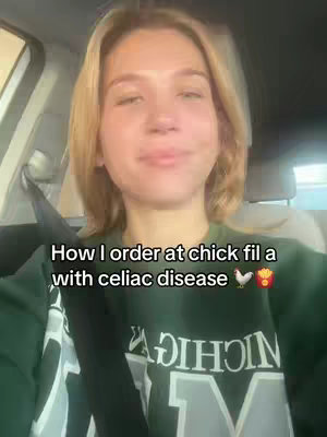 A selfie-style shot taken inside a car, with a woman in the center looking towards the camera. The background is slightly blurred, showing the car's interior and some daylight. The woman is wearing a dark green sweatshirt with white lettering. Text overlay at the bottom describes the video's focus.