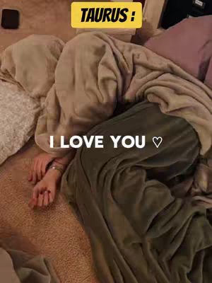 The image shows a person wrapped in blankets, with only their arm and hand visible. The text overlay reads, "TAURUS : I LOVE YOU \u2661".
