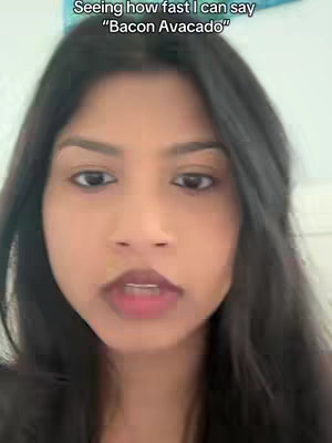 A selfie-style video featuring a woman with dark hair and fair skin, centered in the frame with a close-up shot. She is looking directly at the camera with a slight smile. The lighting appears to be soft and diffused. Above her head is overlaid text.