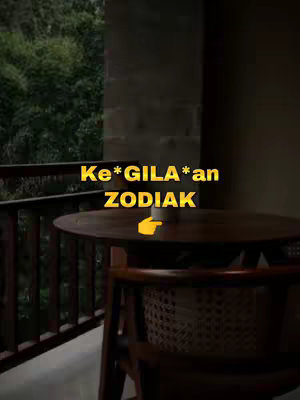 A dimly lit scene featuring a wooden table and chair on a balcony overlooking lush greenery. The text overlay in a yellow color announces a Zodiac theme.