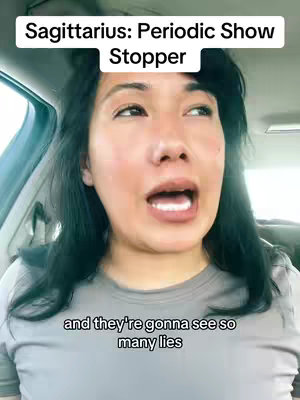 A woman with dark hair is filming herself, looking up and slightly to the side with an open mouth. Text overlays indicate the video's focus on astrology, specifically Sagittarius.