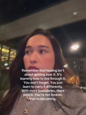 A person with dark hair and light skin looks slightly off-camera, with text overlayed. The background is a blurred outdoor nighttime scene.