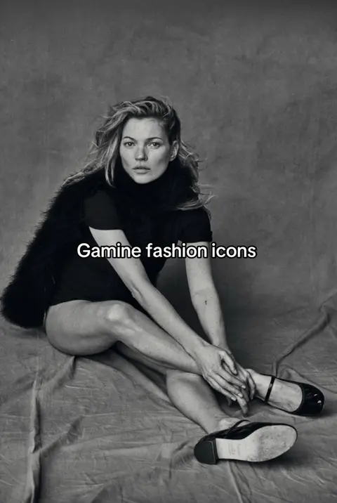 A black and white image featuring a woman in a relaxed seated pose. She is wearing a black top and a fur-like shawl and black shoes. She is on a grey background. The text overlayed reads "Gamine fashion icons".