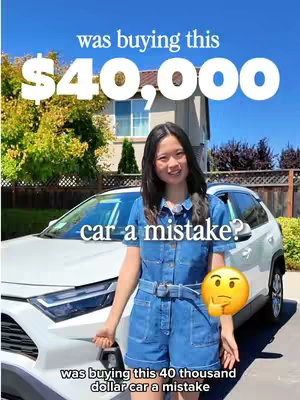 A woman stands in front of a white Toyota RAV4, with text overlayed indicating the car's price of $40,000 and asking if the purchase was a mistake. The woman is wearing a denim jumpsuit and smiling, with a house and trees in the background under a blue sky.