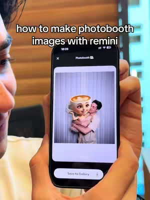 A person holding a smartphone displaying the Remini app's photobooth feature. On the screen, a humorous image shows a cartoon coffee cup holding a doll-like person in a hug.