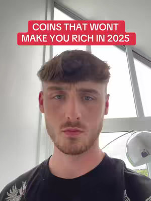 The cover image features a young man in a close-up shot, set against an indoor background. He wears a black t-shirt and has short, dark hair with a fringe. Above him, a red rectangular banner displays white text. The man has a serious expression, with a slight beard and mustache visible. The background appears out of focus in a bright setting, with an element of modern design like a shiny sphere or a modern-style lamp.
