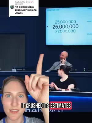The cover image is a split composition. On the left, a woman with blue eyes looks directly at the camera, pointing upwards with her index finger. On the right, split in half with the woman's image, is a scene with two other people in the background, one speaking into a phone. At the top, a screen displays numbers, and a text overlay reading "IT CRUSHED ITS ESTIMATES" in a red box.