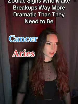 A young woman with long brown hair is centered in the frame, gazing slightly off-camera with a red curtain in the background and text overlayed indicating zodiac signs and their behaviors.