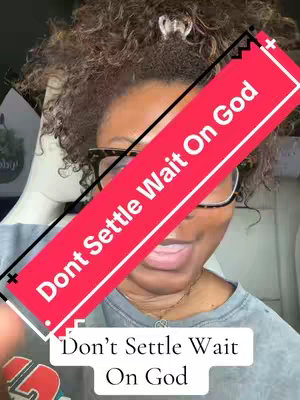 The cover image shows a close-up of a woman with curly hair wearing glasses. A diagonal red banner across her face has white text on it, and a white rectangular box in the lower portion of the image also contains additional text. The woman is smiling, and her facial expression is warm. The background is subtly blurred, suggesting an indoor setting.