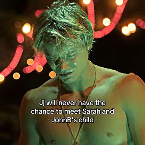A young man, shirtless, with wet, tousled hair, is looking down with a distressed expression. Soft, colorful string lights are visible in the background.