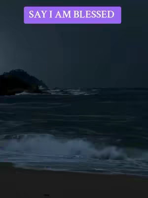 The cover image shows a dark seascape with waves crashing on a shore under a stormy sky. A rectangular text overlay in a light purple gradient, prominently displays the text "SAY I AM BLESSED".