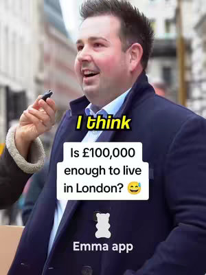A man in a navy blue blazer is standing outside, likely in London, with a microphone held near his mouth. A caption overlay asks if 100,000 pounds is enough to live in London.