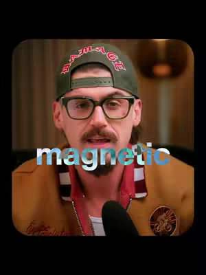 The cover image is a selfie of a man wearing glasses, a baseball cap, and a jacket; the word "magnetic" appears in bold, blue text across the center of the image.