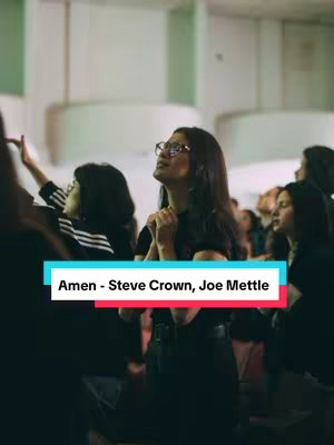 An interior shot shows a group of people, primarily women, with their hands raised in worship. A text overlay highlights the song title and artists.