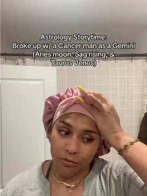 The cover image features a woman in front of a plain background. The woman is wearing a light grey shirt, and a pink head covering. She has a gold necklace and a gold bracelet. There is text overlayed on the top half, with the title and details of the video. 