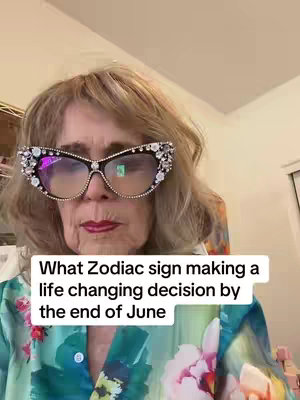 The cover features a middle-aged woman with blonde hair and large, bejeweled glasses looking directly at the camera. She's wearing a floral blouse. A text overlay in a white box reads: "What Zodiac sign making a life changing decision by the end of June."
