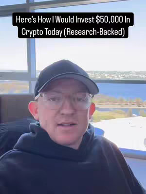 A man in a black hoodie and a black baseball cap is the central figure, slightly off-center to the left. He's wearing glasses and facing the camera. Behind him is a large window overlooking a city skyline and water. Above him, a text overlay in a black box announces the video topic.