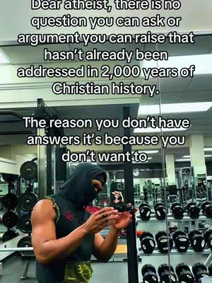 A person wearing a black face covering is holding a phone in a gym setting, with weights visible in the background. Text overlays the image with religious and philosophical statements.