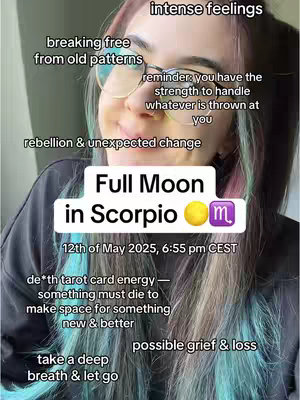 A selfie-style image featuring a woman with glasses and colorful hair. Text overlays describe astrological themes, including a full moon in Scorpio.