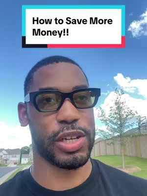 The image features a man with short dark hair, wearing black-framed glasses, and a black shirt. He is the primary focus, positioned in front of a light blue sky with scattered clouds. Above him, a rectangular overlay displays white text on a teal background, separated by a black line from a red bottom. In the background, a green lawn and trees are visible.