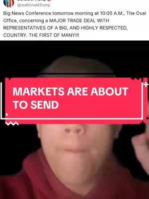 A selfie video. A person with fair skin and dark hair is centered in frame, wearing a deep red shirt. A red banner with white text floats across their face. Above, text about a trade deal featuring Donald Trump appears set against a black background.