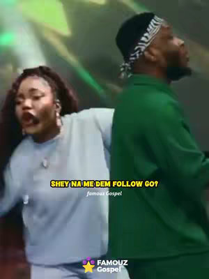 The image showcases two people, a woman and a man, on a stage with a blurred, colorful background. The woman, positioned in the foreground on the left, is wearing a light blue long-sleeved top, and her eyes are wide open. Beside her, is a man, gazing away from the camera wearing a green shirt and black cap with a white pattern. The text overlay which is yellow with a black stroke reads 'SHEY NA ME DEM FOLLOW GO?' and a smaller text directly below it that reads 'famouz Gospel', located at the bottom are a yellow star and text that read 'FAMOUZ Gospel'.