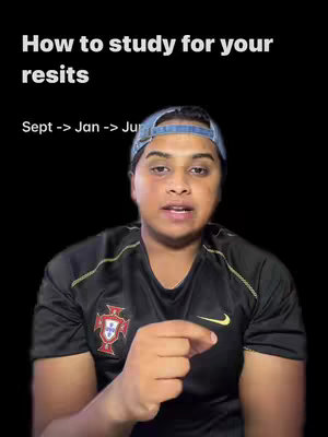 A person with dark hair, wearing a black t-shirt, a denim blue cap and pointing with the right index finger, against a black background with white text at the top.