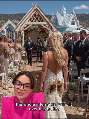 A woman with dark hair and glasses speaks into the camera. Behind her, a wedding scene unfolds. The focus is on a bride with a stained wedding gown. The background includes a ceremony setup with guests and decorative buildings.
