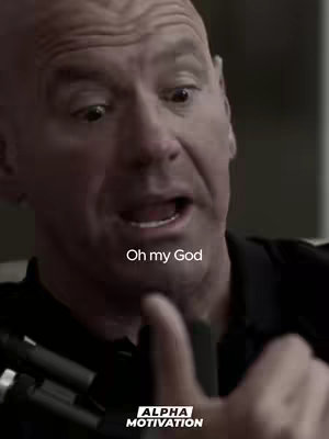 The cover image shows a close-up of a man's face with a surprised expression. He has short, light-colored hair and is looking upwards with wide eyes and an open mouth. The text overlay "Oh my God" is in a white, sans-serif font, approximately halfway up the frame. At the bottom of the frame, the logo "ALPHA MOTIVATION" in white text, is visible.