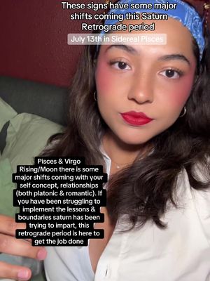 A selfie-style shot of a woman with dark hair, red lipstick, and rosy cheeks, set against a blurred red background. Text overlays explain astrological periods. The woman has dark hair and a blue bandana, and a white shirt.