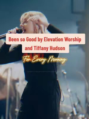 A live performance shot featuring a female singer with blonde hair, holding a microphone and singing. The background is blurred, suggesting a concert setting. Overlaid text provides the song title and artist information.