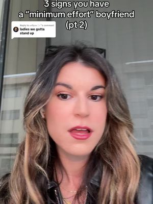 A woman is looking at the camera with a slightly open mouth, suggesting she's speaking. Above her, text in white font states the video topic.  The background is a blurred view of a window with some text overlaid.