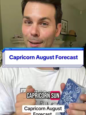 A man in a white shirt holds a deck of cards, the top card is visible. Text overlays include "Capricorn August Forecast" in a blue box and "CAPRICORN SUN". The background shows a room with a mantle and artwork.