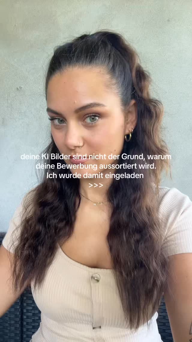 A woman with long, wavy brown hair and green eyes is positioned in front of a neutral background. She's wearing a light-colored top and a delicate necklace. Text overlays highlight the image with text related to job applications and AI-generated images.
