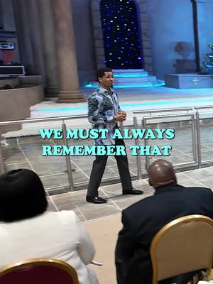 The cover image shows a man standing in a well-lit interior, likely a church or auditorium, and talking. Text overlayed on the image reads "WE MUST ALWAYS REMEMBER THAT". The man is wearing a patterned shirt and dark trousers. Behind him is an elaborately lit doorway which is the backdrop of the scene. Several individuals sit facing him.