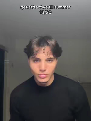 The cover image features a young man in a close-up shot, looking towards the camera. The background is dimly lit, creating a blurred effect. The man is wearing a black sweater, and his hair is styled with a side part and slight wave. Overlaid at the top is white text.