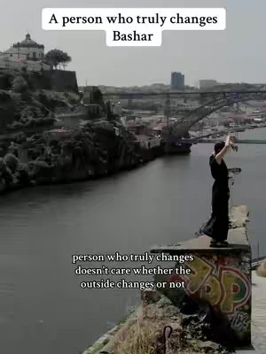 A scenic shot with a person standing on a stone structure, overlooking a river and cityscape. The person, silhouetted, is facing the view with arms raised. The scene includes a bridge and buildings in the background under a bright sky. Text overlays provide context.